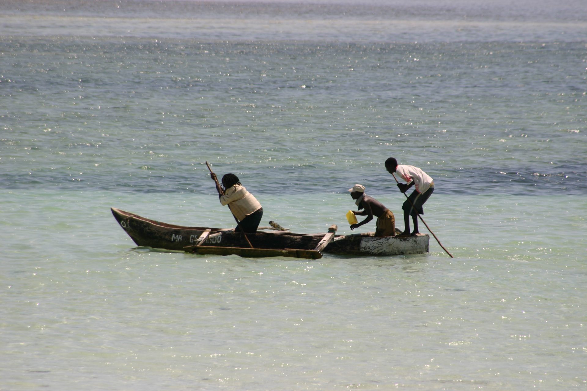 Kenya's Coast Region   Golden sands meet the turquoise waters of Kenya's beaches, framed by swaying palm trees and a clear blue sky. The sun casts a warm glow over the serene scene